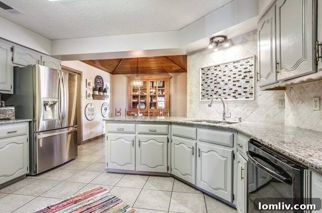 View of kitchen from dining area, showing open concept.