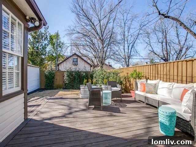 Expansive wooden deck in the backyard, ideal for outdoor entertaining