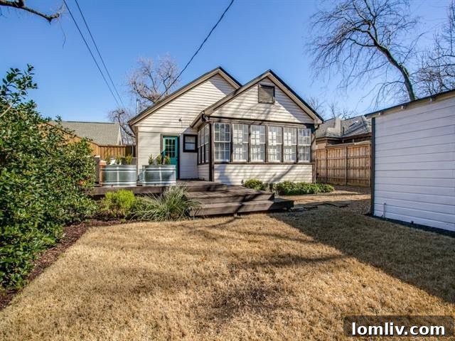 Pathway leading to the backyard deck, surrounded by greenery
