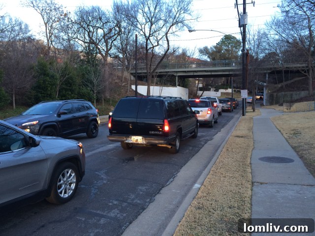 Gridlock traffic on Hall Street near the Lincoln Katy Trail project site, indicative of urban congestion.