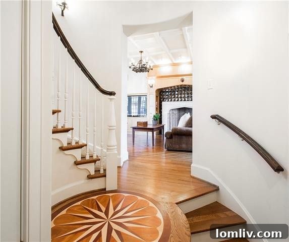 Grand Circular Staircase with Detailed Compass Rose Inlay on Landing