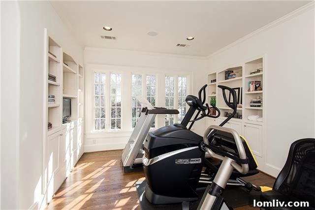 Well-Lit Hallway Connecting Rooms with art on display
