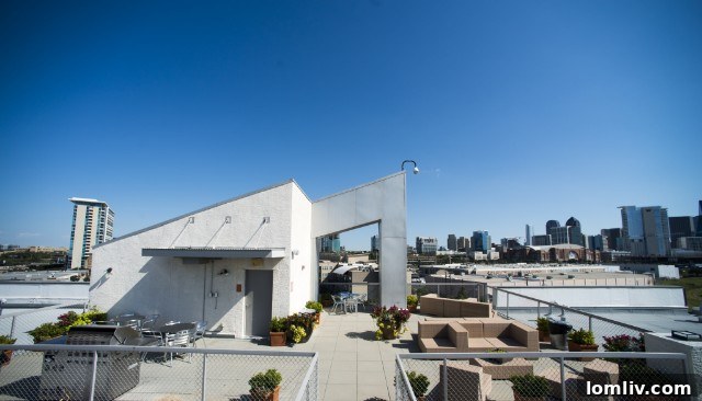 Trinity Loft apartment gym with modern equipment and natural light.
