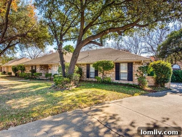Prestonwood Estates living room with vaulted, beamed ceiling, elegant fireplace