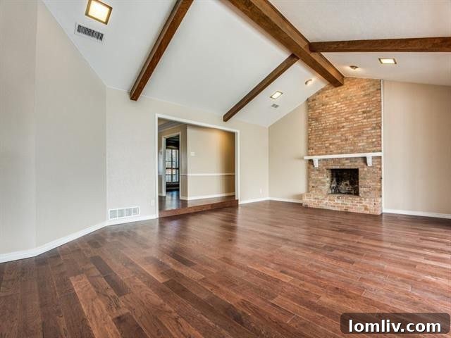 Updated kitchen with custom cabinets, quartz countertops, and modern lighting