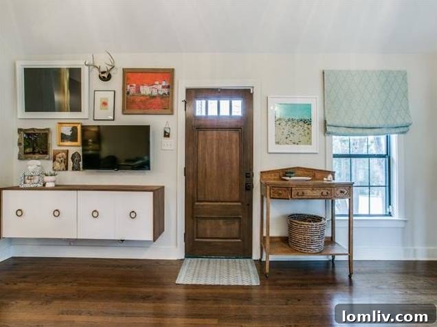 Interior view of the spacious living room at 415 W. Colorado Blvd featuring vaulted ceilings and stylish decor.