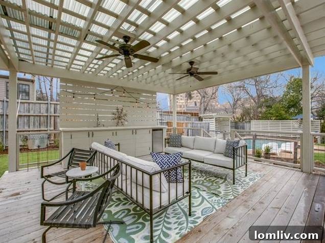 Close-up of the elegant outdoor wet bar and seating area under the pergola.