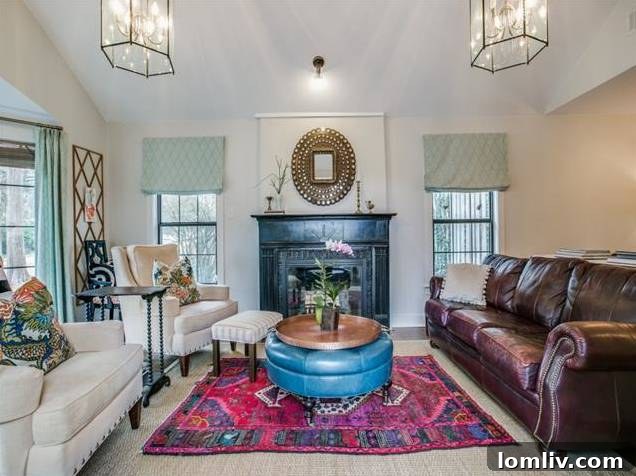 Comfortable seating area with a classic fireplace in the living space.
