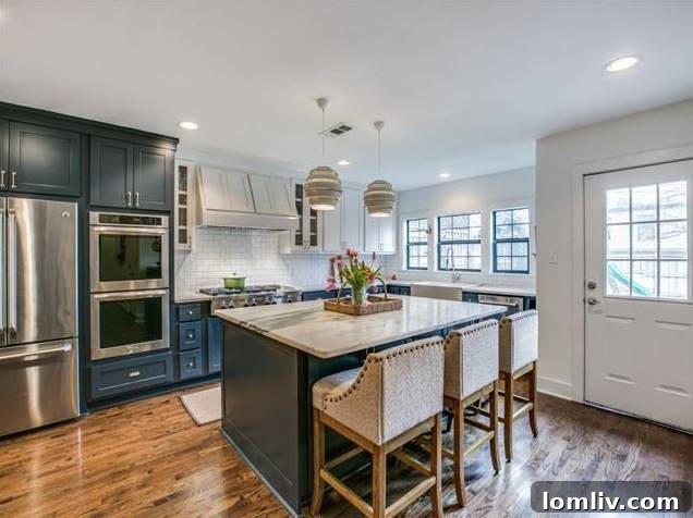 High-end gas range and custom vent hood in the gourmet kitchen.