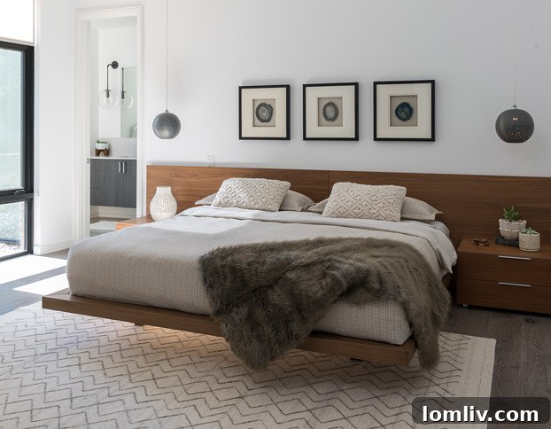 Modern home exterior with large windows and lush landscaping by Michael Hunter