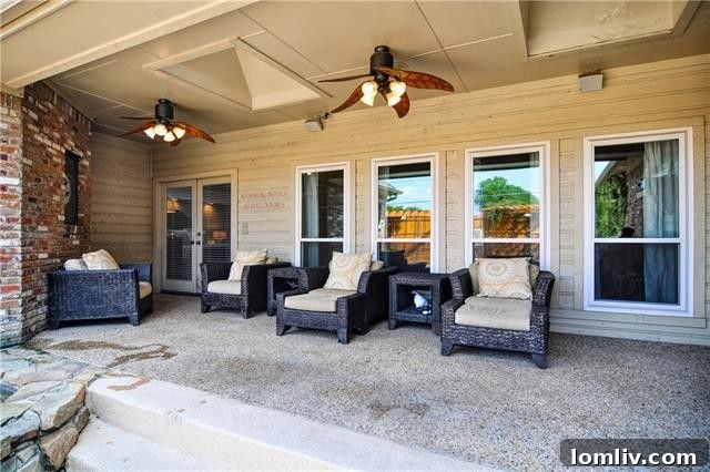 Expansive covered patio overlooking the sparkling pool in Dallas