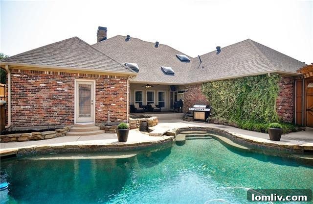 Crystal blue resort-style swimming pool with pergola for outdoor enjoyment