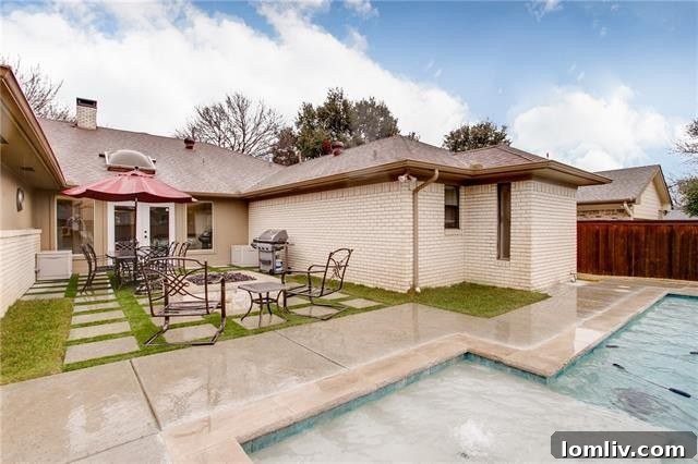 Contemporary Swimming Pool and Spa in Backyard