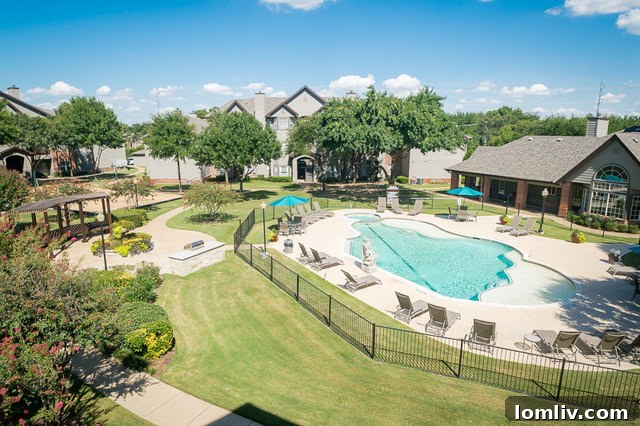 Fountains of Denton apartment exterior with lush landscaping, Denton, TX