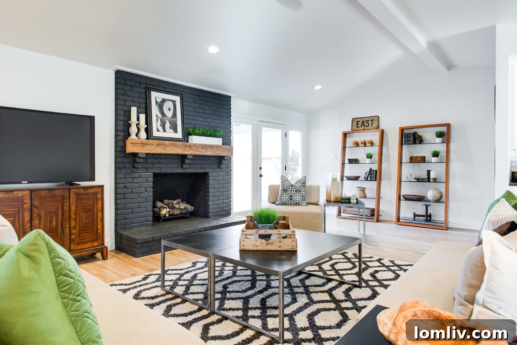 Modern kitchen with black leathered granite countertops and stainless steel appliances
