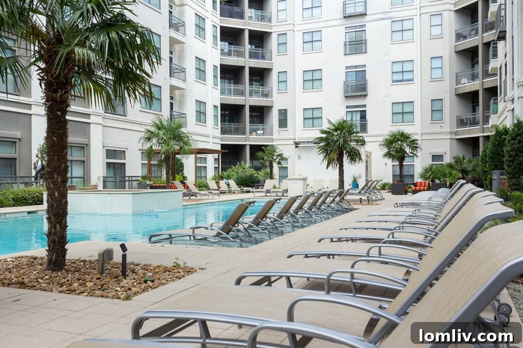 Dallas's Premier Apartment Pools 4 Palm-tree lined resort pool at ilume apartments in Oak Lawn, Dallas