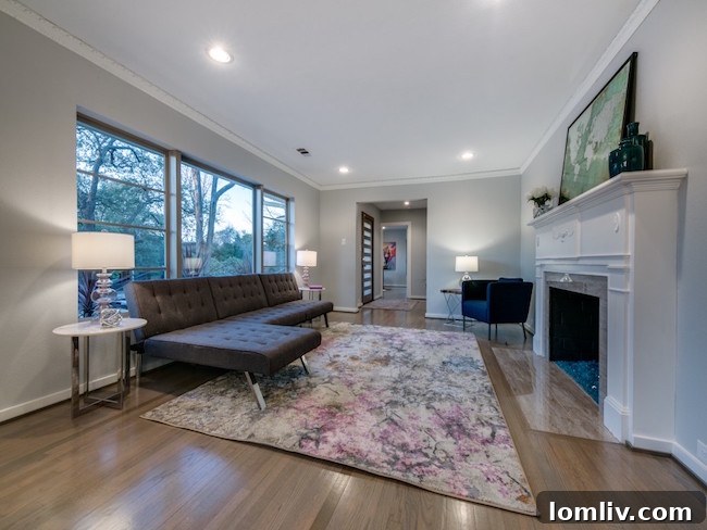 Elegant dining area with modern lighting and refinished hardwood floors at 9606 Losa