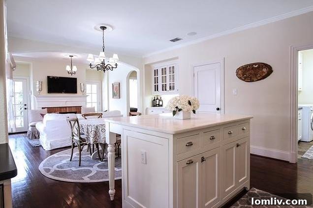 Spacious living room leading to the backyard patio through French doors