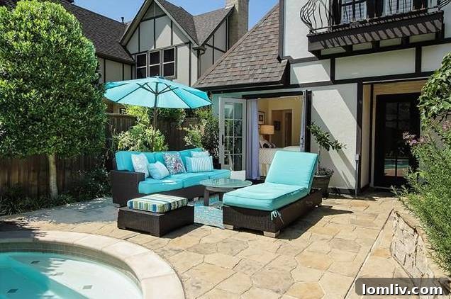 Inviting patio area adjacent to the pool, perfect for al fresco dining and relaxation