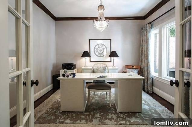 Elegant dining room with chandelier, ready for formal dinners and casual gatherings