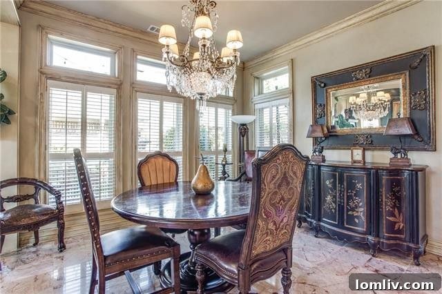 View of the kitchen connecting to living spaces and outdoor patio