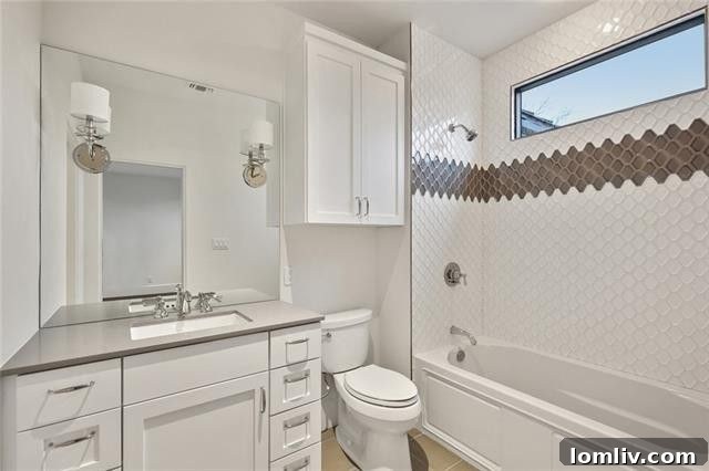 Designer tile treatments in a luxury guest bathroom.