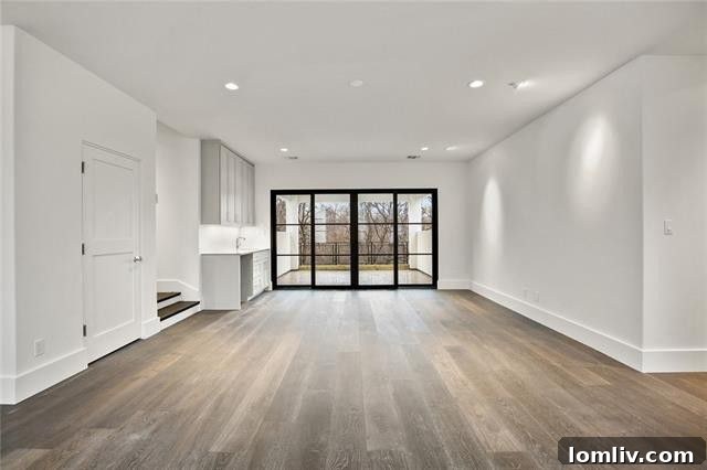 Another perspective of the spacious game room/family room, highlighting its versatile layout.