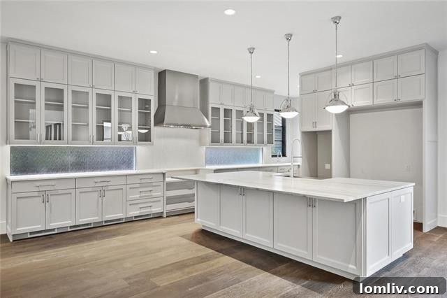 Modern wet bar with designer tile and quartz countertops, perfect for entertaining.