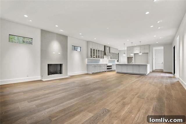 Contemporary living room fireplace with a floor-to-ceiling surround in a luxury Dallas residence.