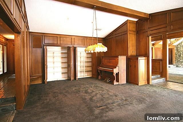 Before and After: Game room transformation with carpet removal and chandelier update