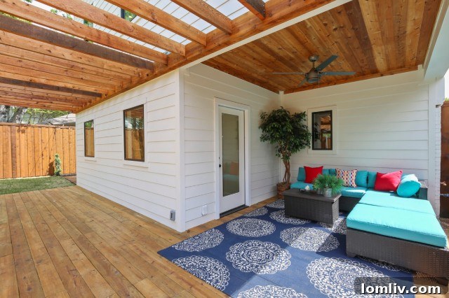 Spacious backyard with cedar carport and covered patio