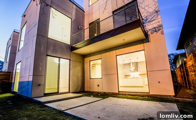 Spacious open-concept living room with floor-to-ceiling windows at Knox View Homes
