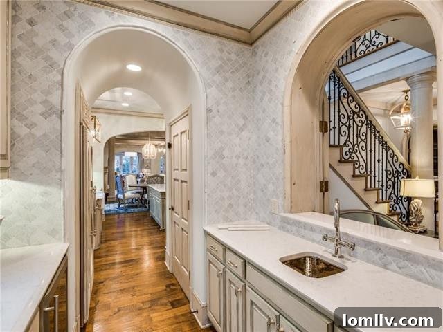 Elegant Kitchen Island with Modern Stools and Chic Lighting