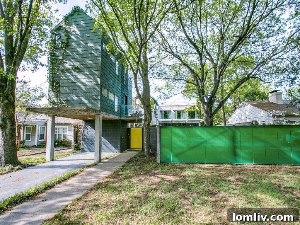Stunning exterior view of the contemporary home at 4404 Greenbrier Drive in University Park, Dallas, showcasing its unique architecture and modern appeal.