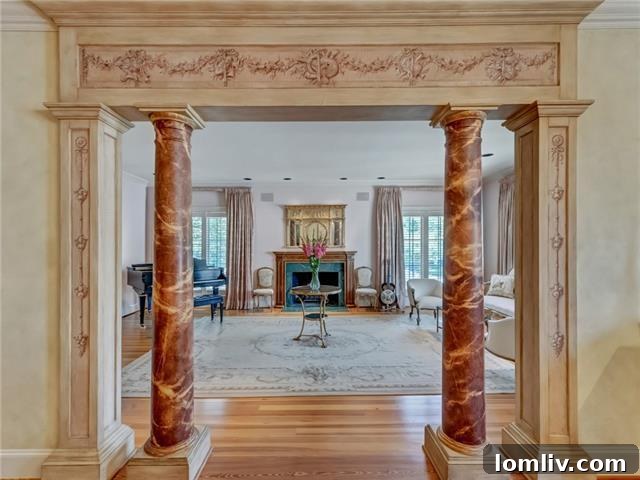 Alta Drive's Subtle Exterior Hides Lavish Grandeur 3 Elegant Living Room with Decorative Arch and Marble Fireplace