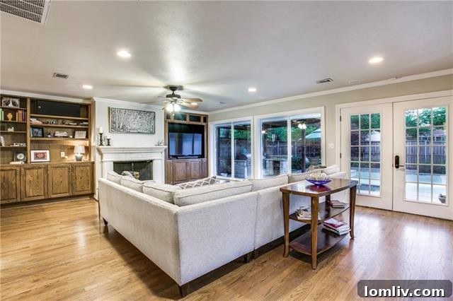 Gourmet kitchen with a large eat-in island, stainless steel appliances, and abundant cabinet storage