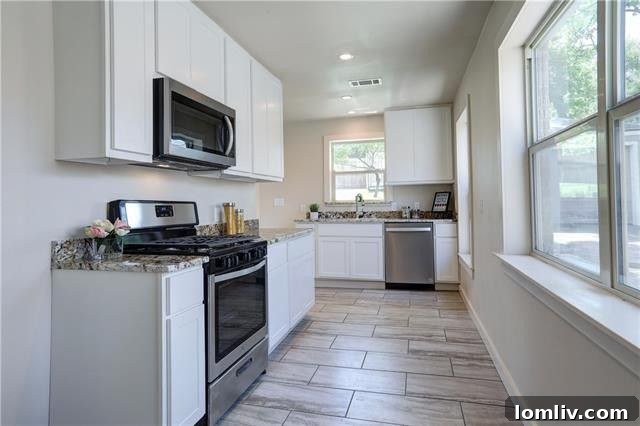 A different angle of the spacious backyard, showcasing its potential for landscaping and outdoor activities.