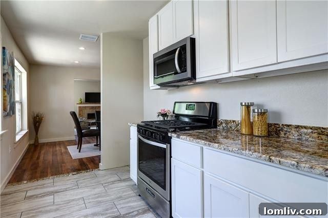 Perspective view of the cottage's side, leading towards the backyard and highlighting the surrounding lush greenery.