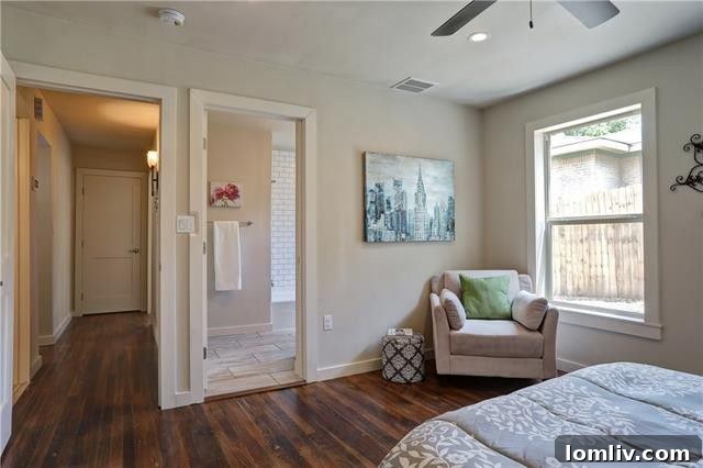 Cozy and bright living room area, decorated with thoughtful touches, showcasing the warmth of the hardwood floors.