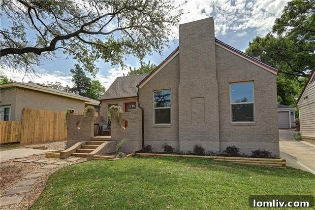 Inviting front porch of the Irwindell cottage, leading to the main entrance and offering serene views of the Dells District neighborhood.