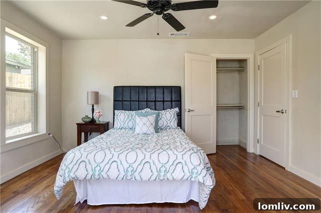 Master bathroom, showcasing its modern vanity, mirror, and updated lighting, reflecting a blend of comfort and style.