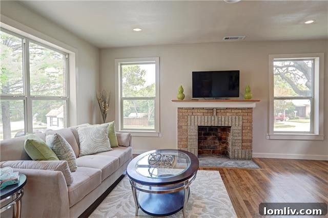 View of the second bedroom, showcasing its good size and comfortable atmosphere, illuminated by large windows.
