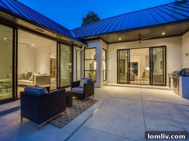 Inviting backyard with lush landscaping and seating area, ideal for entertaining