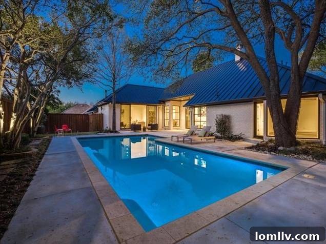 View of the sparkling remodeled swimming pool and surrounding patio