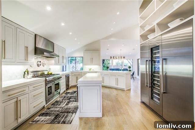Modern master bathroom with sculptural tub and marble