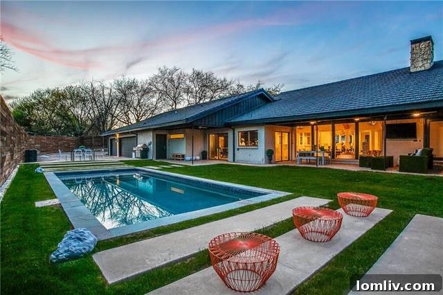 Sleek swimming pool and covered patio for entertaining