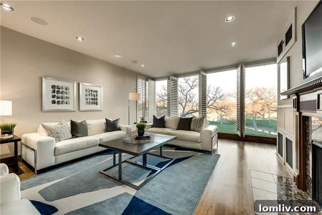 Elegant living space with dramatic skylights and a view of the golf course
