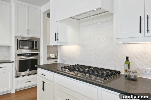 White herringbone tile backsplash, one of many designer tile options at Residences at CityLine