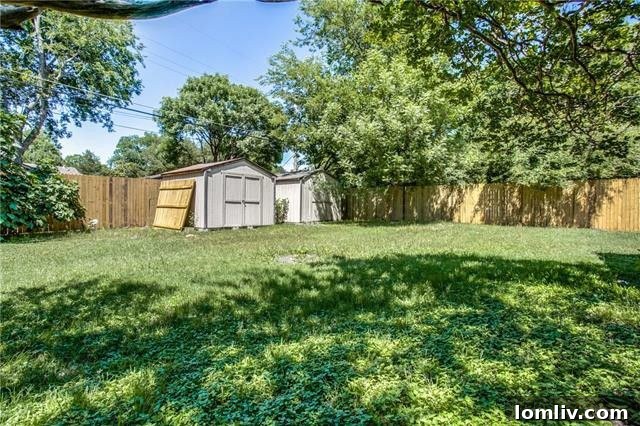 Full View of the Renovated Exterior and Backyard