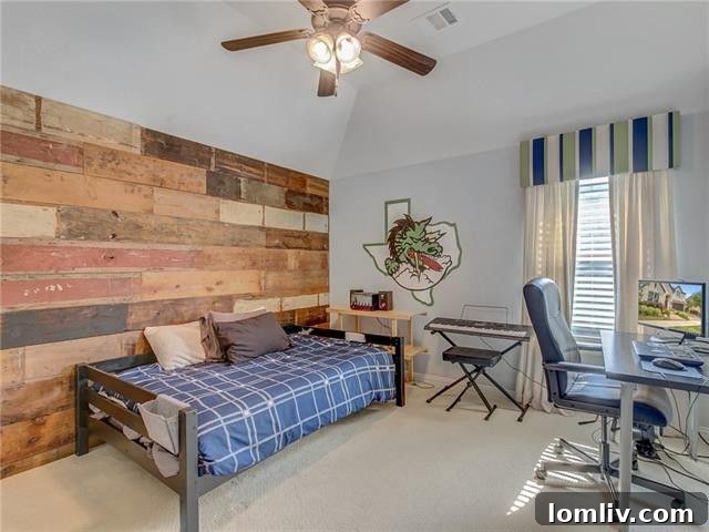 Another view of the custom home theater, showcasing its comfortable and private ambiance.